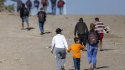 EAGLE PASS, TEXAS - JANUARY 08:  Immigrants from Venezuela walk towards a U.S. Border Patrol transit center after crossing the Rio Grande into the United States on January 08, 2024 in Eagle Pass, Texas. Immigrant crossings in the area have dipped dramatically since a major surge in the last months of 2023. (Photo by John Moore/Getty Images)