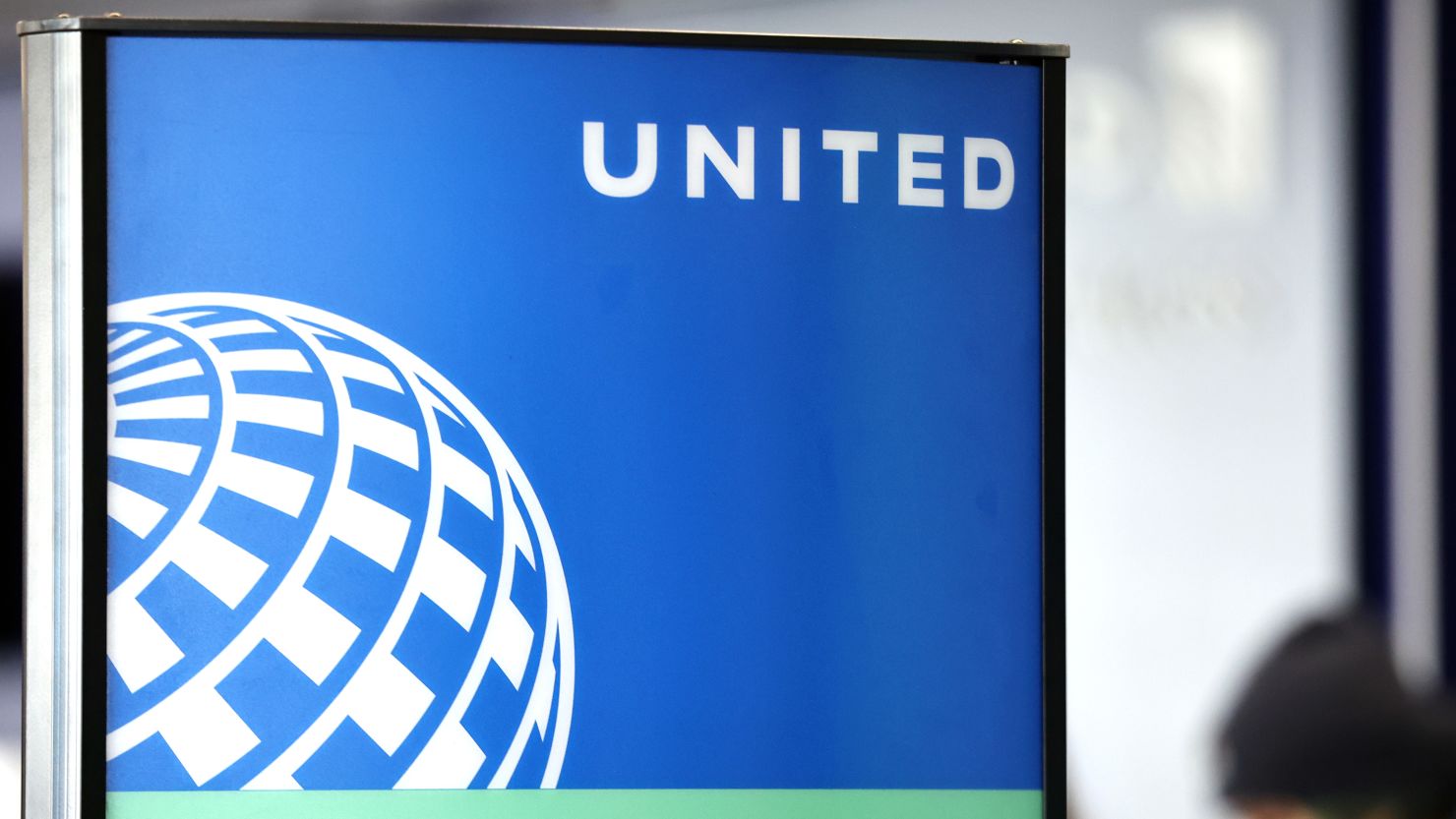 The United Airlines logo is displayed at a check-in area at Los Angeles International Airport (LAX) on January 8, 2024.