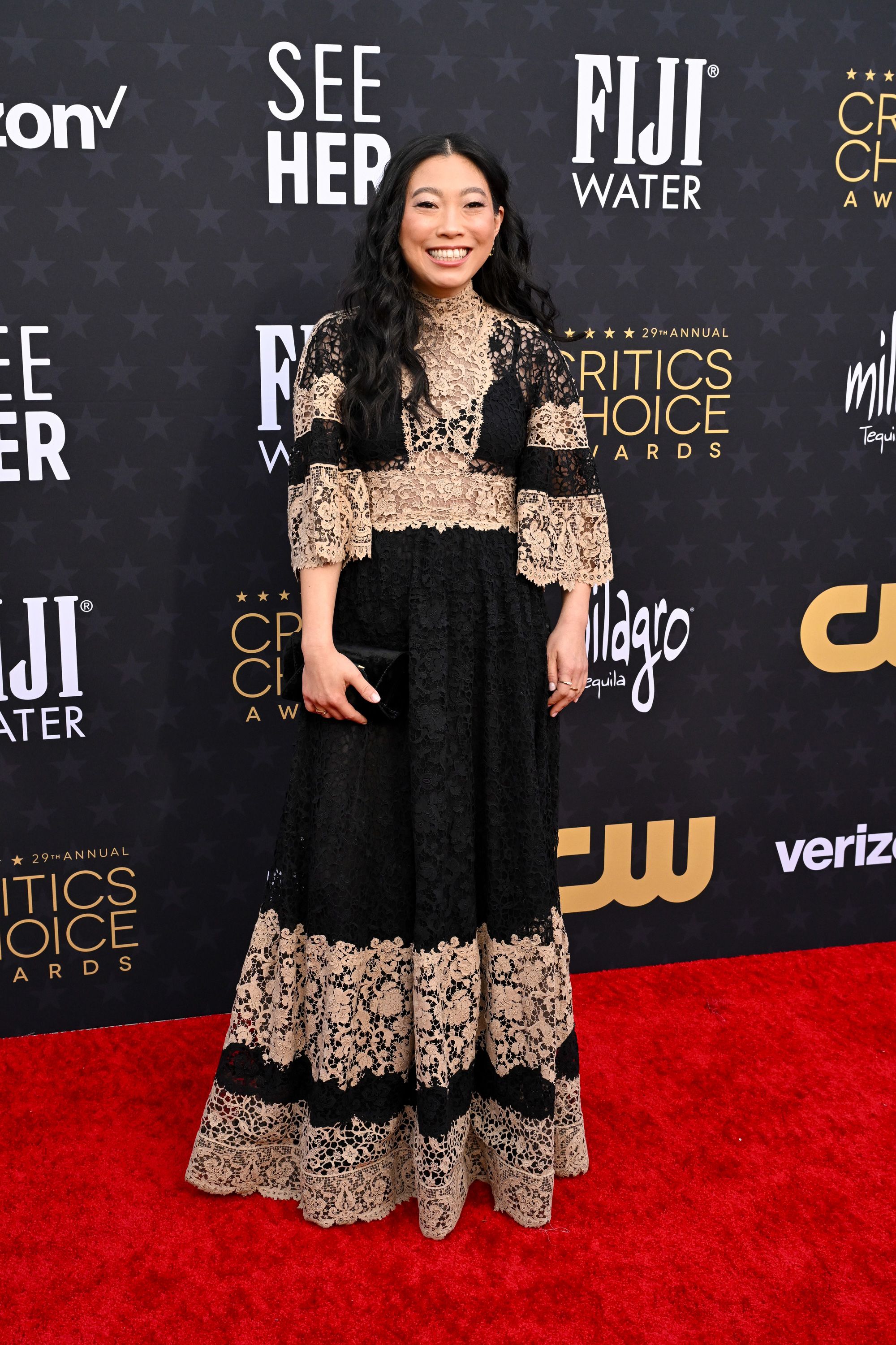 Rapper and actress Awkwafina looked elegant in a two-tone lace Dior Haute Couture dress.