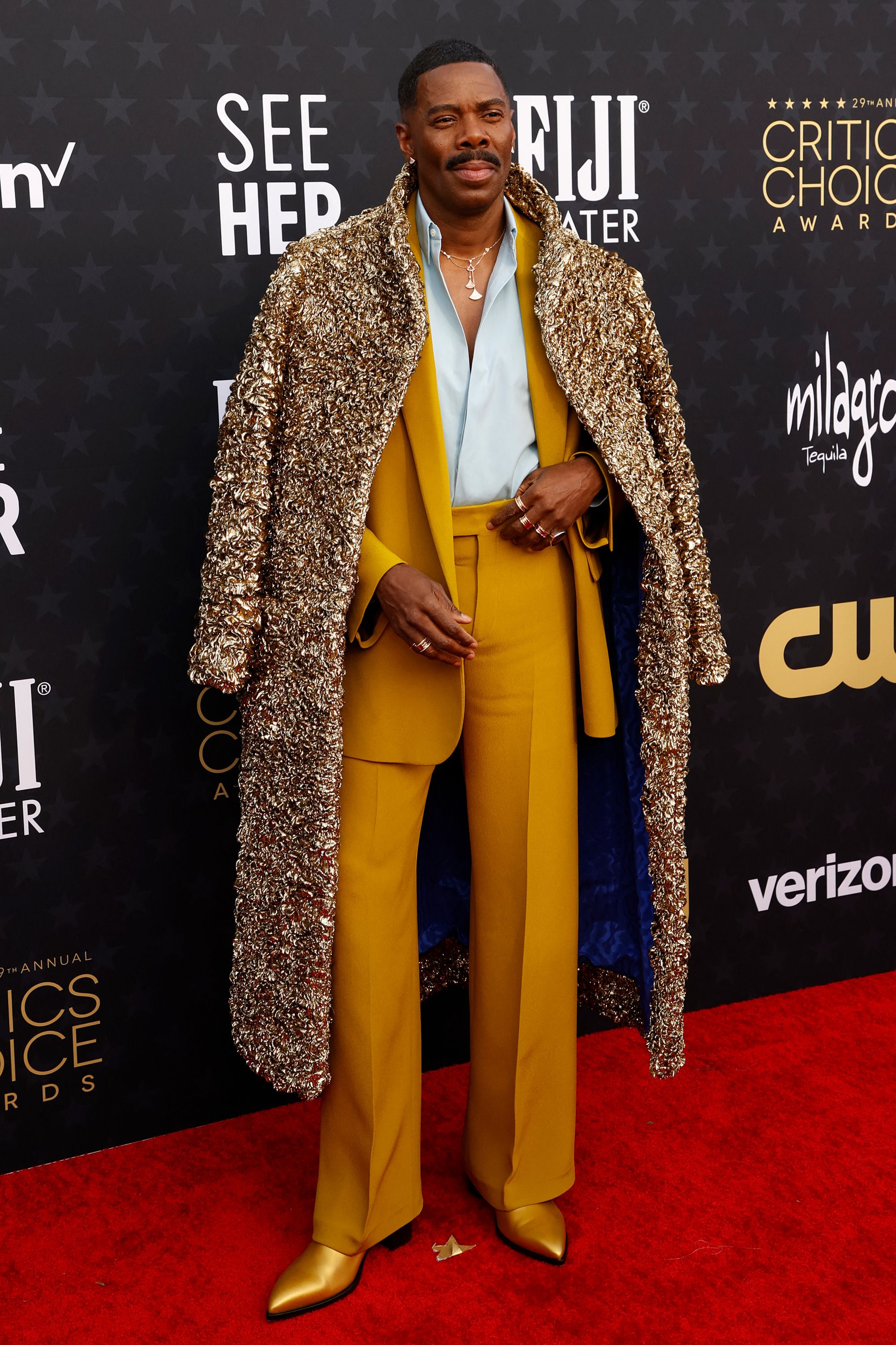 Colman Domingo, nominated for his performance in "Rustin," wore a custom Valentino outfit featuring a mustard suit with a golden overcoat and matching shoes. “I have a sense of play,” he said during the red carpet preshow. “I’m not always playing dark characters.”