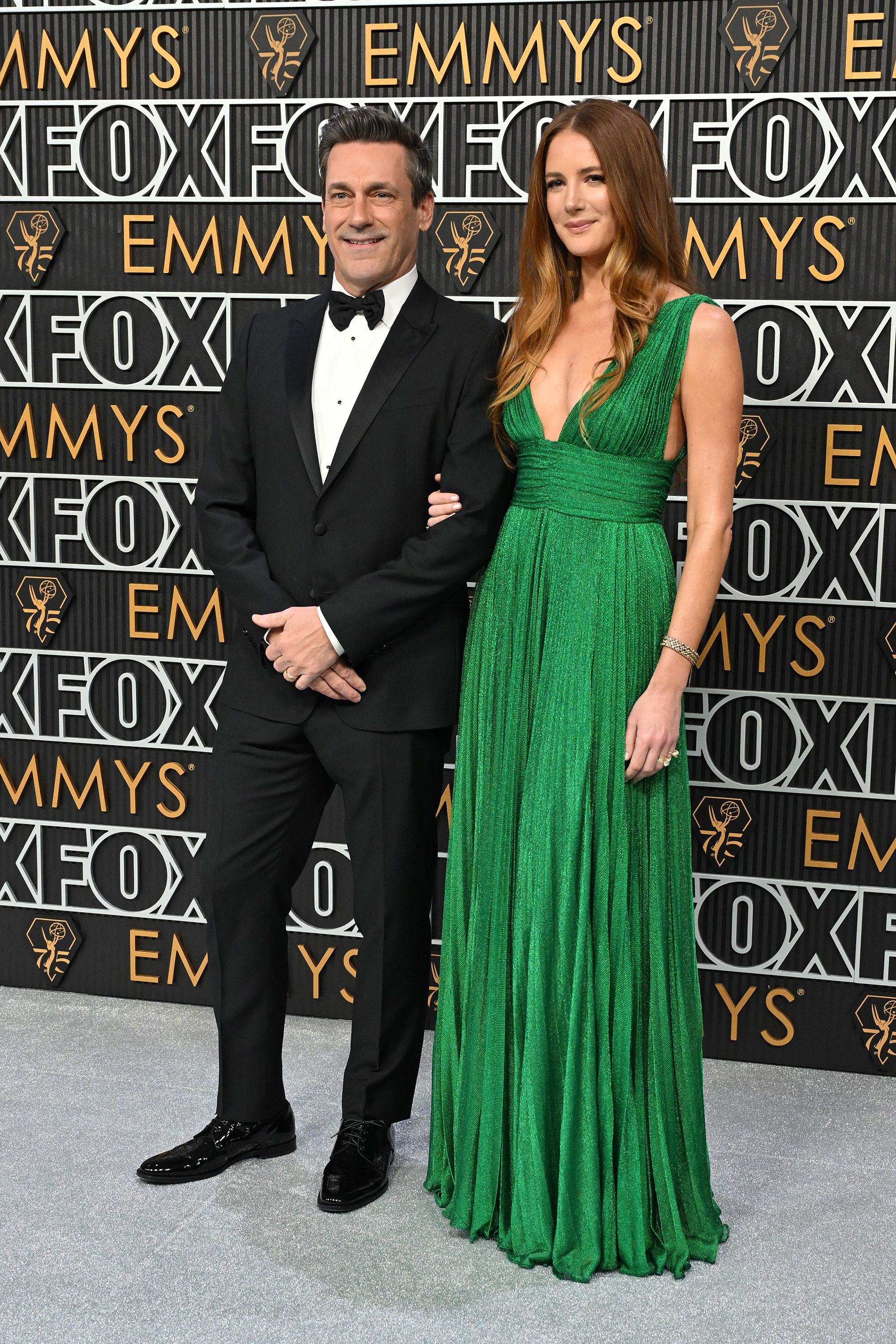 Jon Hamm’s classic tux and his wife Anna Osceola’s shimmering green pleated dress were both from Dolce & Gabbana.