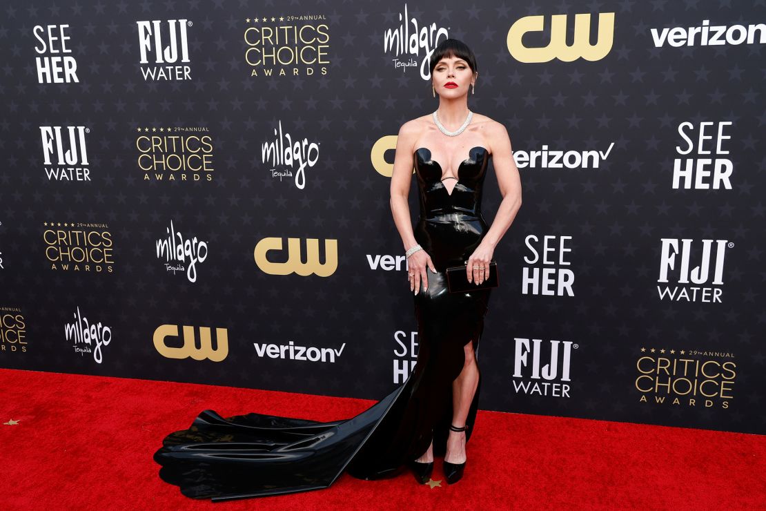 Christina Ricci channeled Morticia Addams with a black latex Atsuko Kudo dress with deep sweetheart neck. She completed the look with a Carolina Herrera clutch and diamond jewelry by Bucherer.