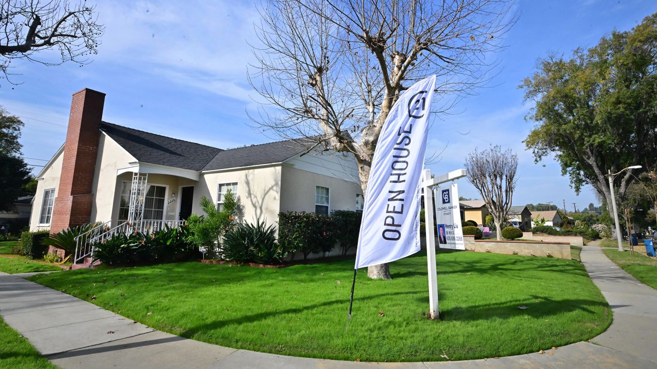 An "Open House" flag is seen in front of a home for sale in Alhambra, California on January 18, 2024. Mortgage rates this week have dropped to its lowest level in eight months for potential US homebuyers but affordability remains a challenge.