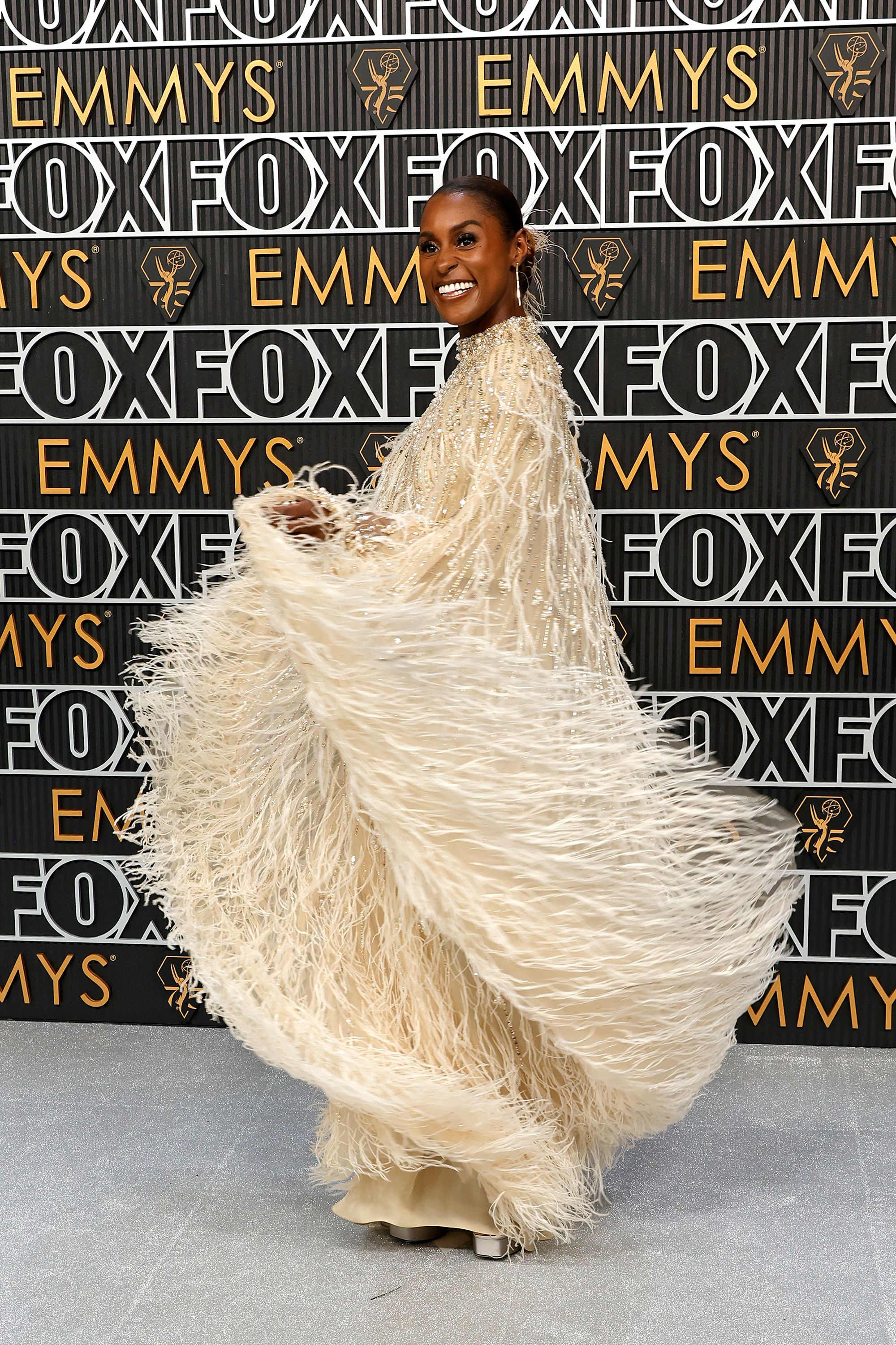 Issa Rae in a feathery Pamella Roland gown with pearl and crystal embellishments.