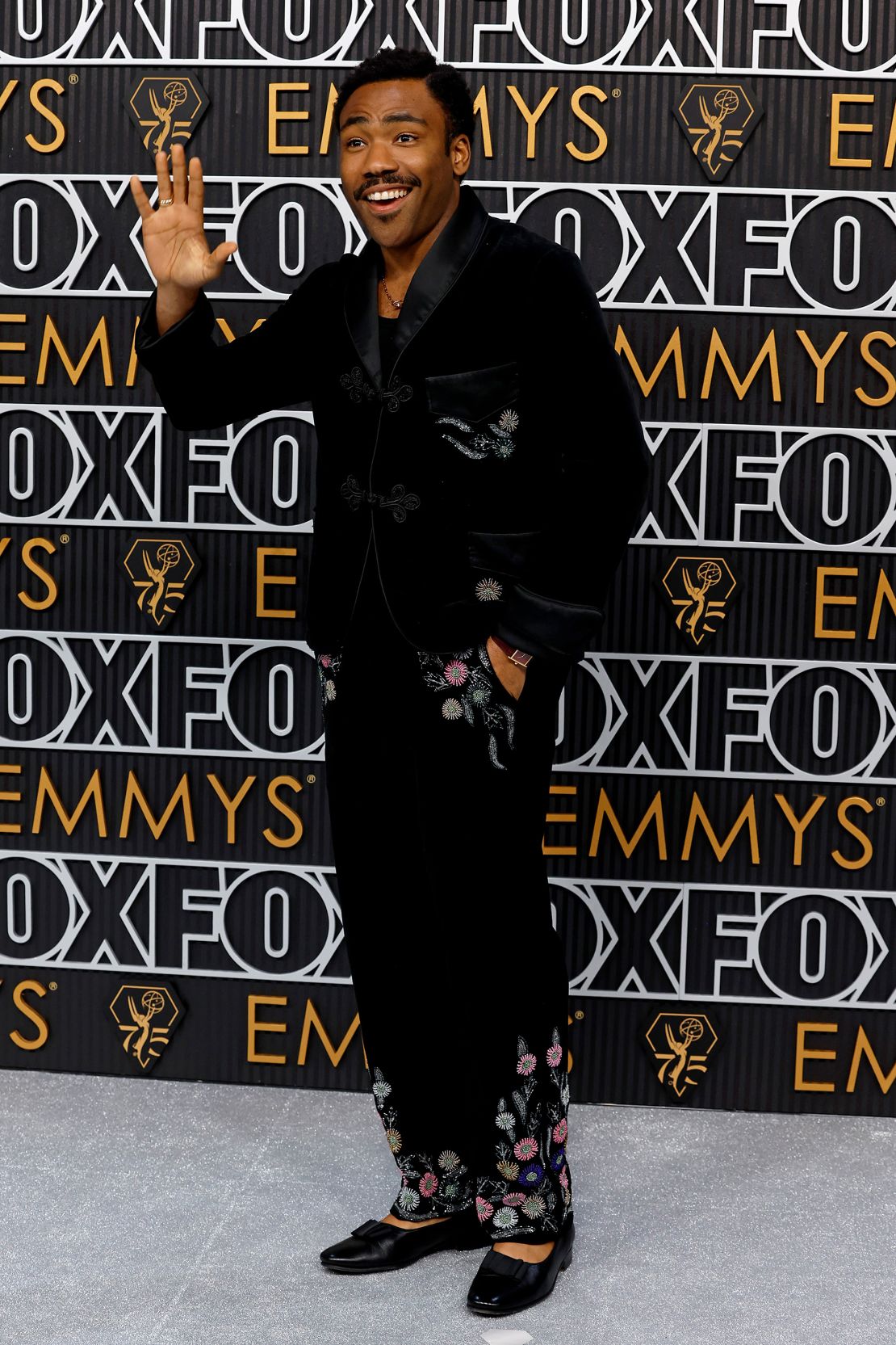 Actor Donald Glover, nominated as a writer for “Swarm,” wore a Bode velvet top and pants with beaded flower detailing.