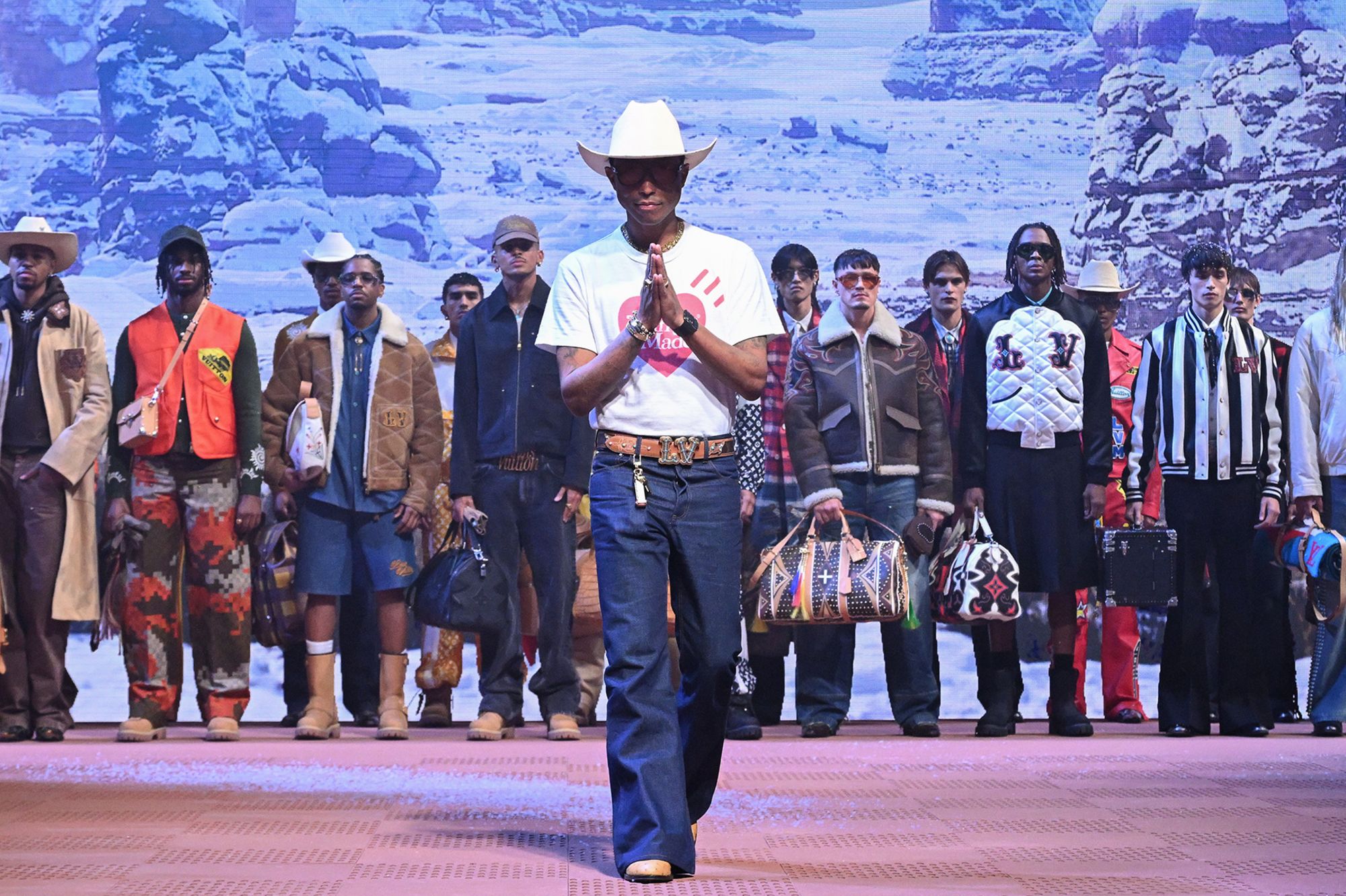 Creative director Pharrell Williams takes to the runway at the end of Louis Vuitton's Fall-Winter 2024-2025 show in Paris.