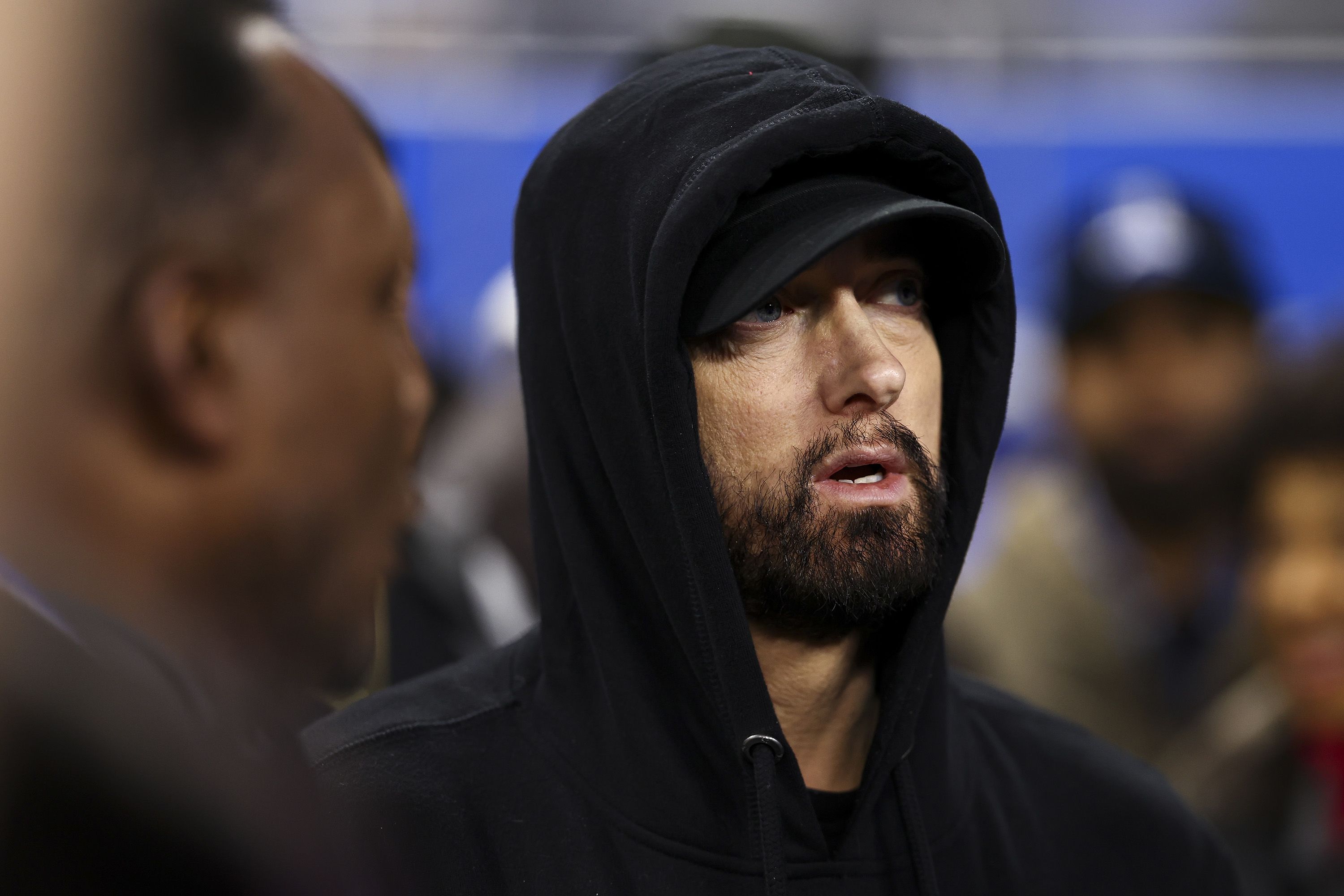 Rapper Eminem stands on the field before the January 14 game between the Detroit Lions and Los Angeles Rams.