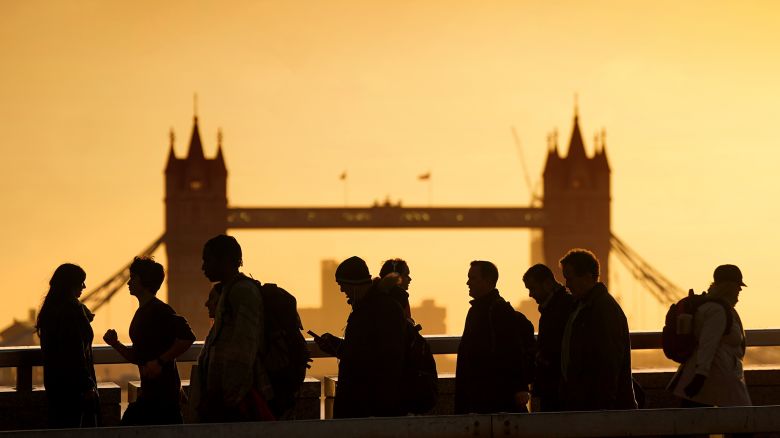 Commuters battle strong winds on London Bridge on Monday, January 22, 2024.