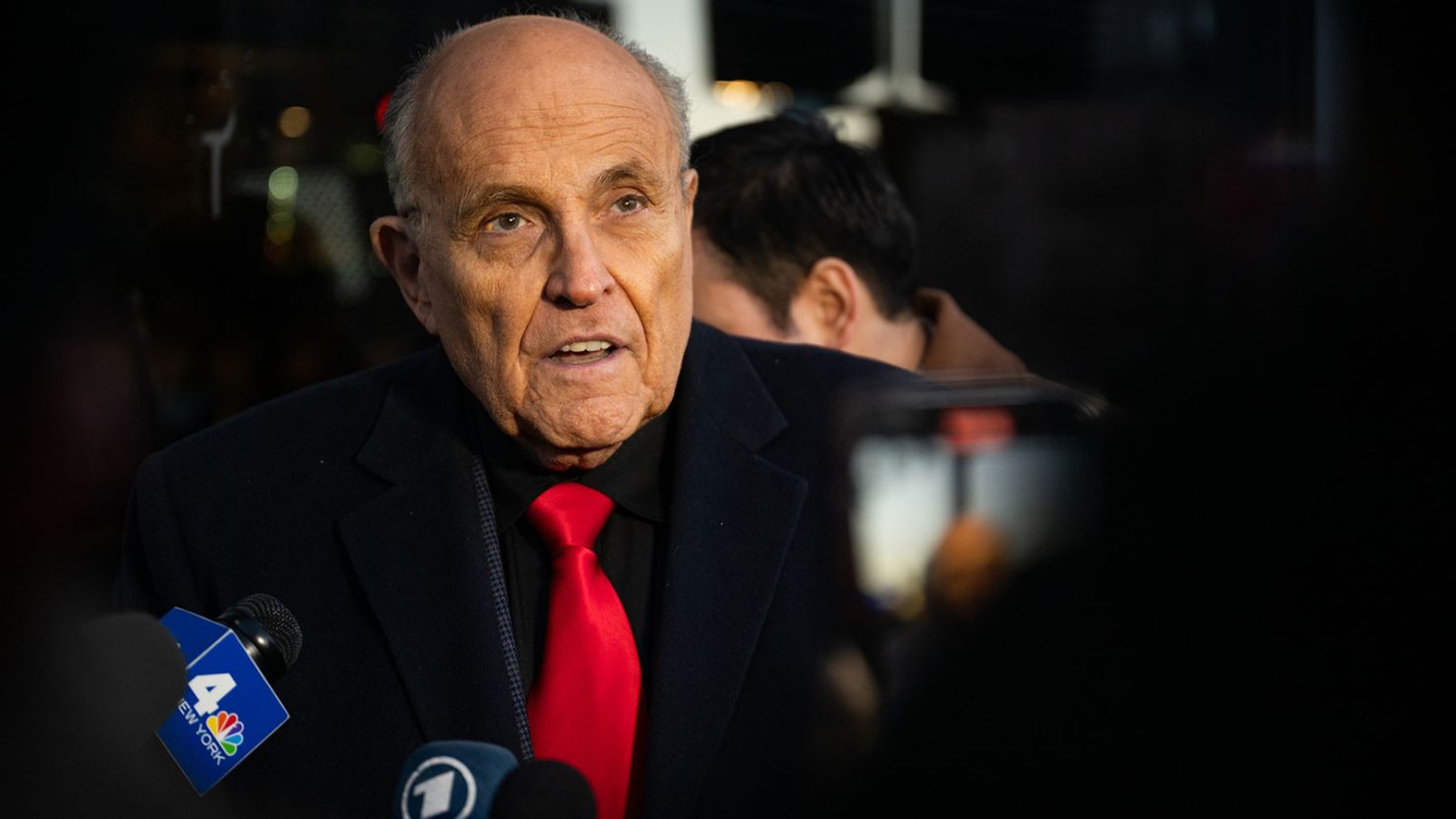 Rudy Giuliani speaks to members of the media where Republican candidate Florida Gov. Ron DeSantis was scheduled to host a campaign event on January 21, 2024 in Manchester, New Hampshire.