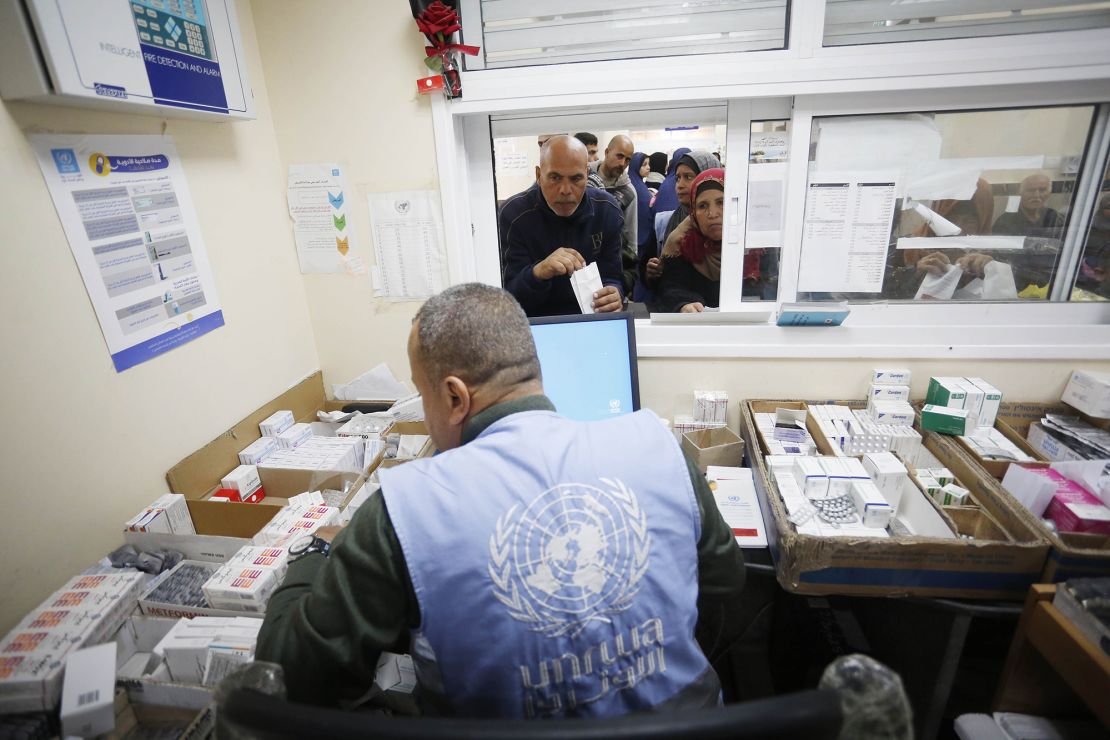 Palestinian patients gather at an UNRWA health center to receive medicine in Deir al Balah, Gaza, on January 21.