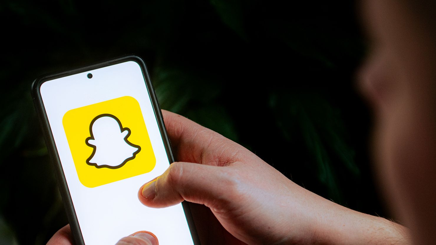 In this photo illustration a Snapchat logo seen displayed on a smartphone.