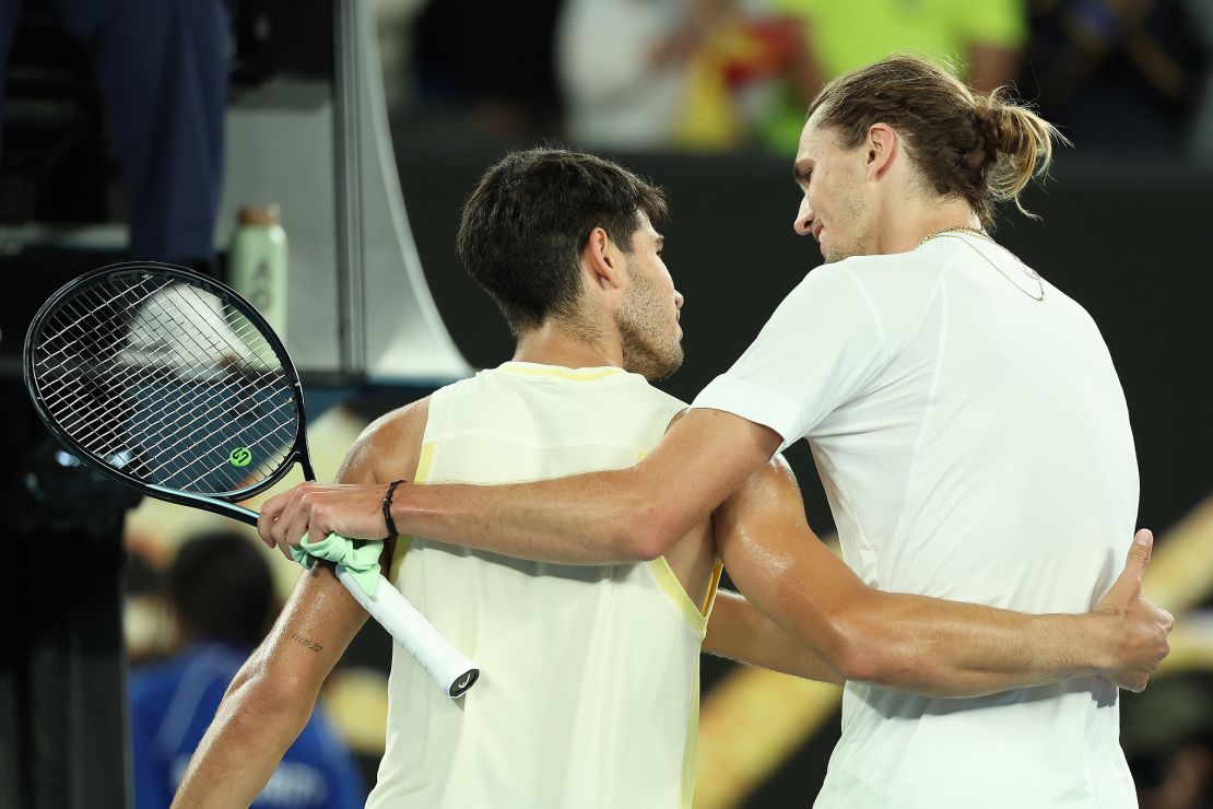 Carlos Alcaraz (left) and Zverev embrace at the net following their quarterfinals match at this year's Australian Open.