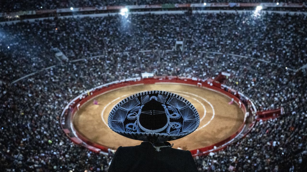 TOPSHOT - A man wearing a traditional mariachi hat watches a bullfight at the Monumental Plaza de Toros Mexico in Mexico City on January 28, 2024. Bullfighting resumed on Sunday in Mexico City after the Supreme Court revoked an earlier suspension. (Photo by CARL DE SOUZA / AFP) (Photo by CARL DE SOUZA/AFP via Getty Images)