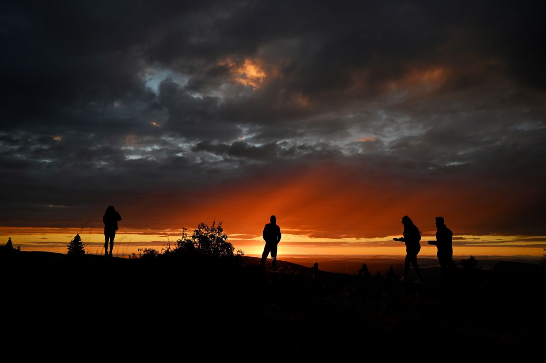 Last-minute vacations to coastal Maine, with a crowd gathering here on top of Cadillac Mountain, could offer savings this year.