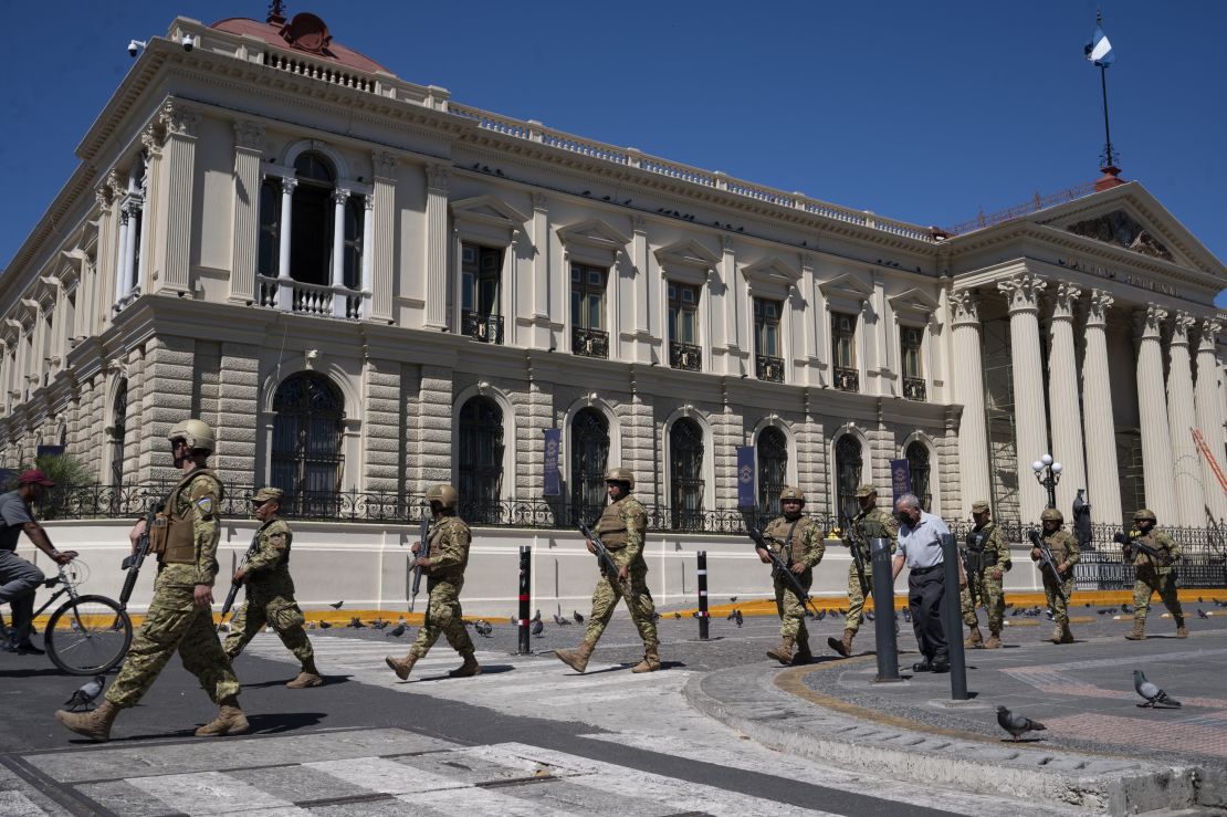 Soldiers patrol in front of the National Palace building at the Barrios square in the historic center of San Salvador on January 31, 2024.