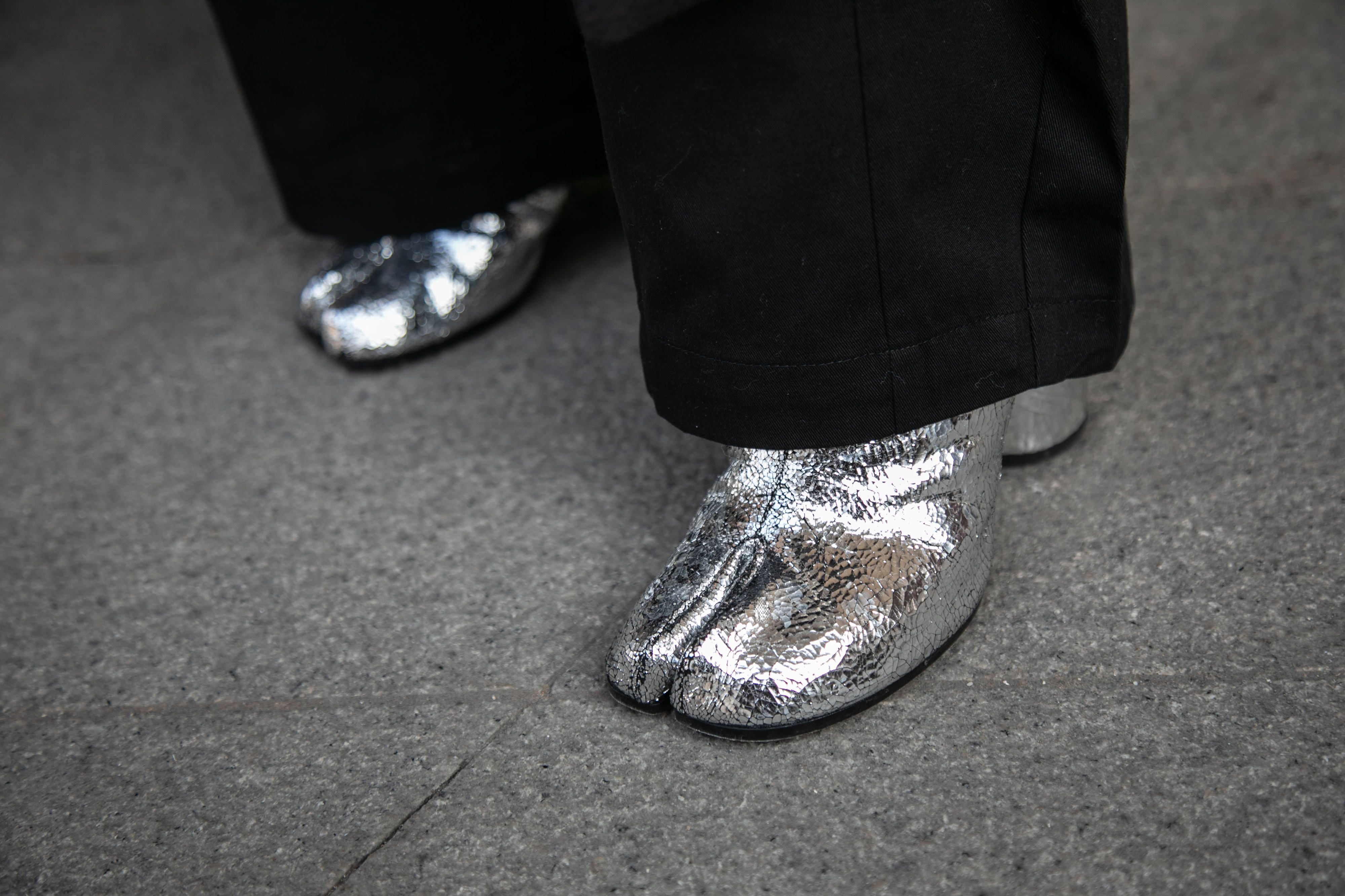 Choi Heui-seung (also pictured top) wears a pair of metallic-colored Maison Margiela boots.