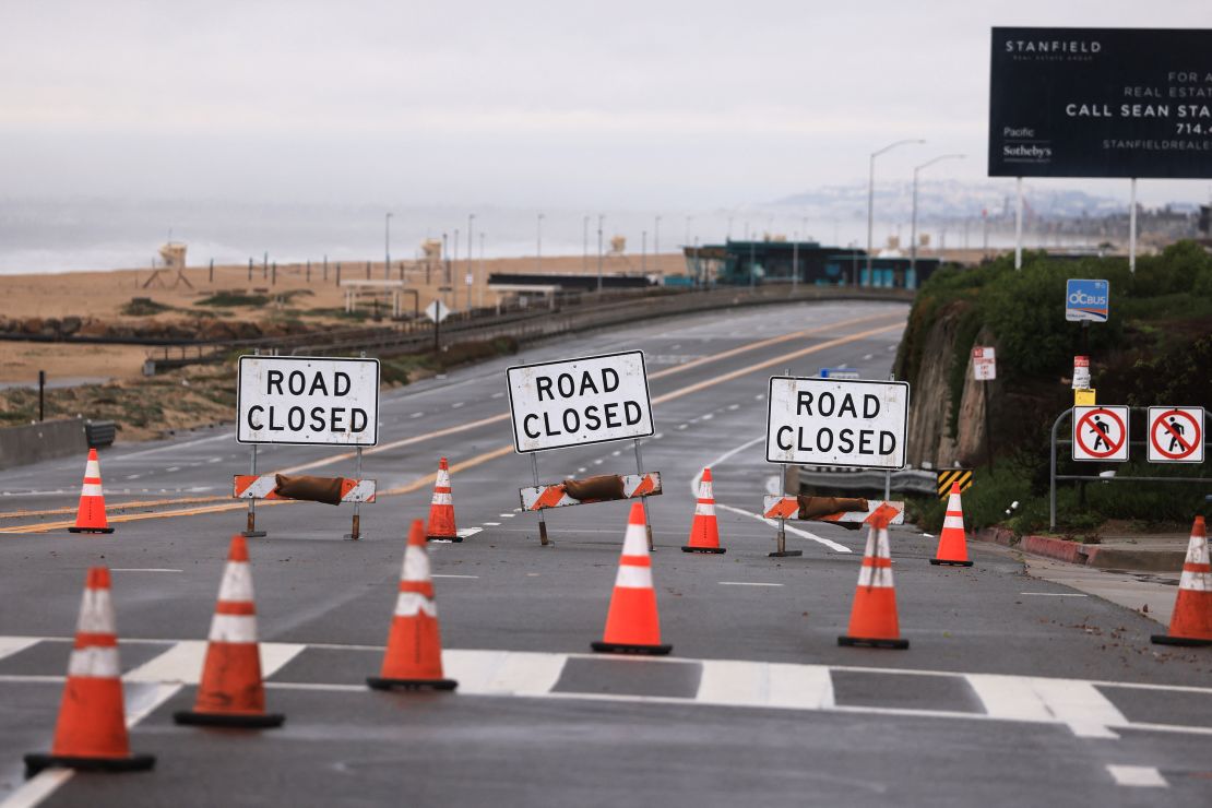 A section of the Pacific Coastal Highway closed Thursday from flooding during a rain storm in Bolsa Chica, near Huntington Beach, California.
