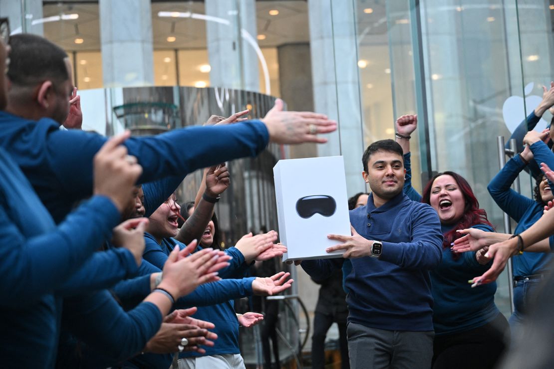 The first customer walks out of the Apple Store with his purchase of the Vision Pro headset in New York on February 2, 2024. The Vision Pro, the tech giant's $3,499 headset, is its first major release since the Apple Watch nine years ago.