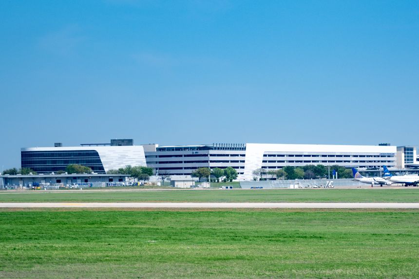 Aircraft park near terminal buildings in 2023 at Austin-Bergstrom International Airport in Texas.
