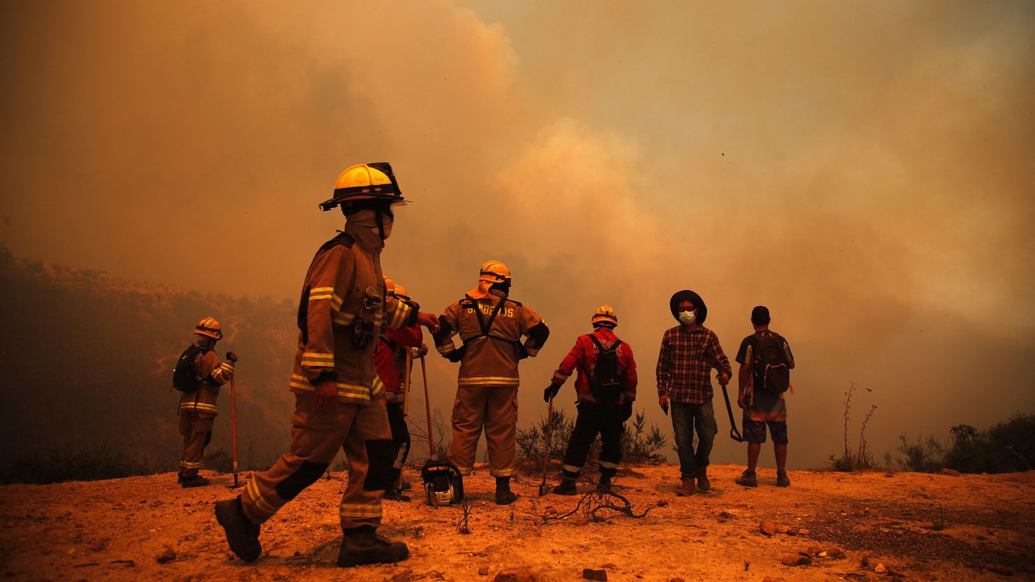 Firefighters in the hills of Valparaiso, Chile on February 3, 2024, as the country suffers its most lethal fires on record.