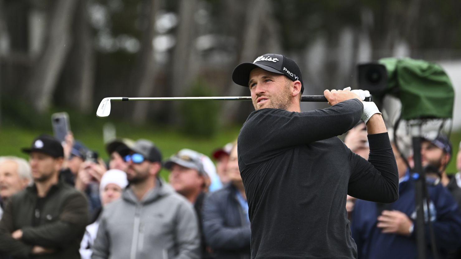 Clark hits his tee shot on the 17th hole at Pebble Beach.