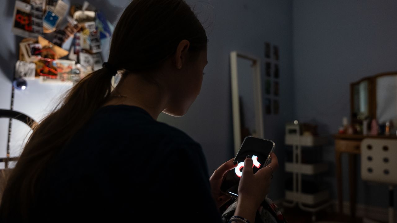 NEW YORK, NEW YORK - JANUARY 31: In this photo illustration, a teenager uses her mobile phone to access social media on January 31, 2024 in New York City. Technology executives appeared at a Senate hearing to address accusations that their companies are endangering children's lives by not adequately policing predators and others who seek to harm and exploit young social media s. (Photo illustration by Spencer Platt/Getty Images)