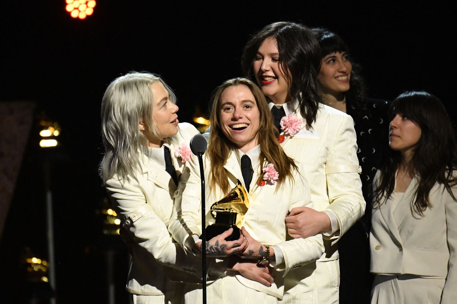 From left, Phoebe Bridgers, Julien Baker and Lucy Dacus — aka the supergroup boygenius — accept the Grammy for best rock song ("Not Strong Enough") before the live show.