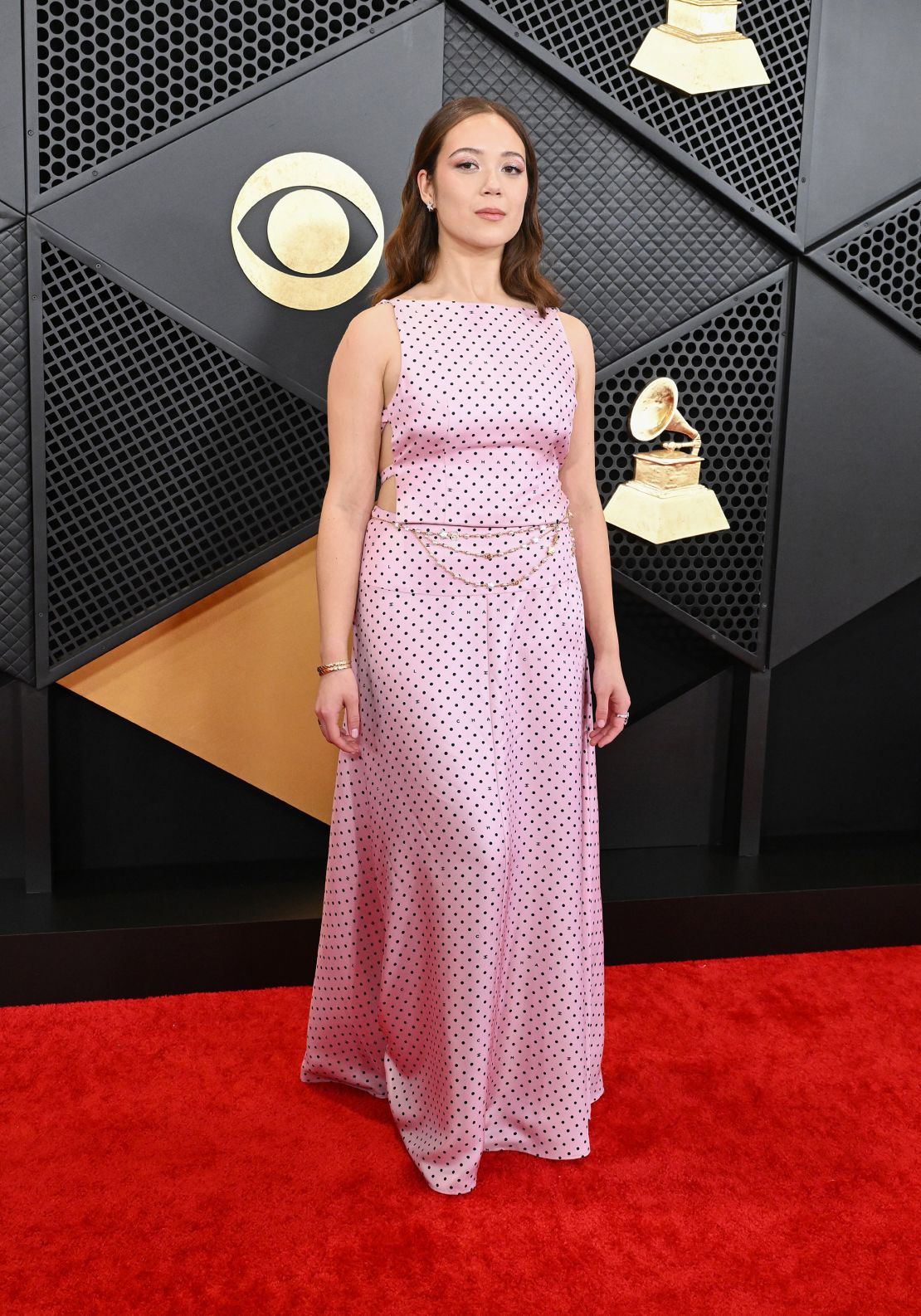 Icelandic singer-songwriter Laufey, who went on to win a Grammy for her jazz album “Bewitched,” wore a floor-length polka dot dress by Chanel.