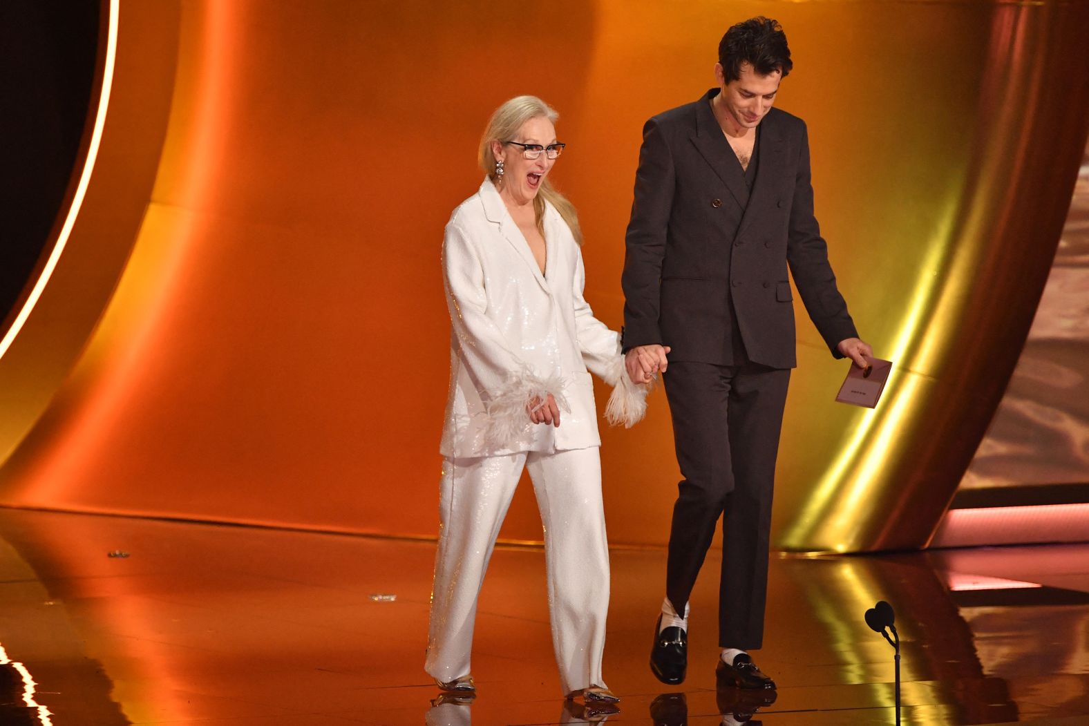 Actress Meryl Streep and her son-in-law, musician Mark Ronson, walk on stage to present the Grammy for record of the year.