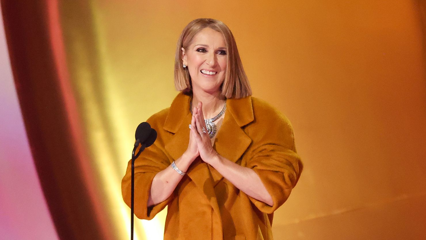 Celine Dion speaks onstage at the 66th Grammy Awards on Sunday.