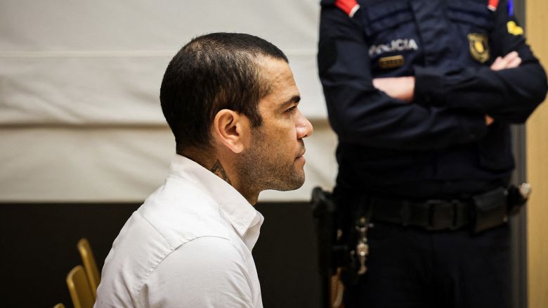 TOPSHOT - Brazilian footballer Dani Alves looks on at the start of his trial at the High Court of Justice of Catalonia in Barcelona, on February 5, 2024. Brazilian footballer Dani Alves, a former star at Barca and PSG, goes on trial in Barcelona accused of raping a woman in a local nightclub. Prosecutors are asking for a nine-year prison sentence, followed by 10 years of conditional liberty. They are also asking he pay 150,000 euros ($162,000) in compensation to the woman. (Photo by Jordi BORRAS / POOL / AFP) (Photo by JORDI BORRAS/POOL/AFP via Getty Images)