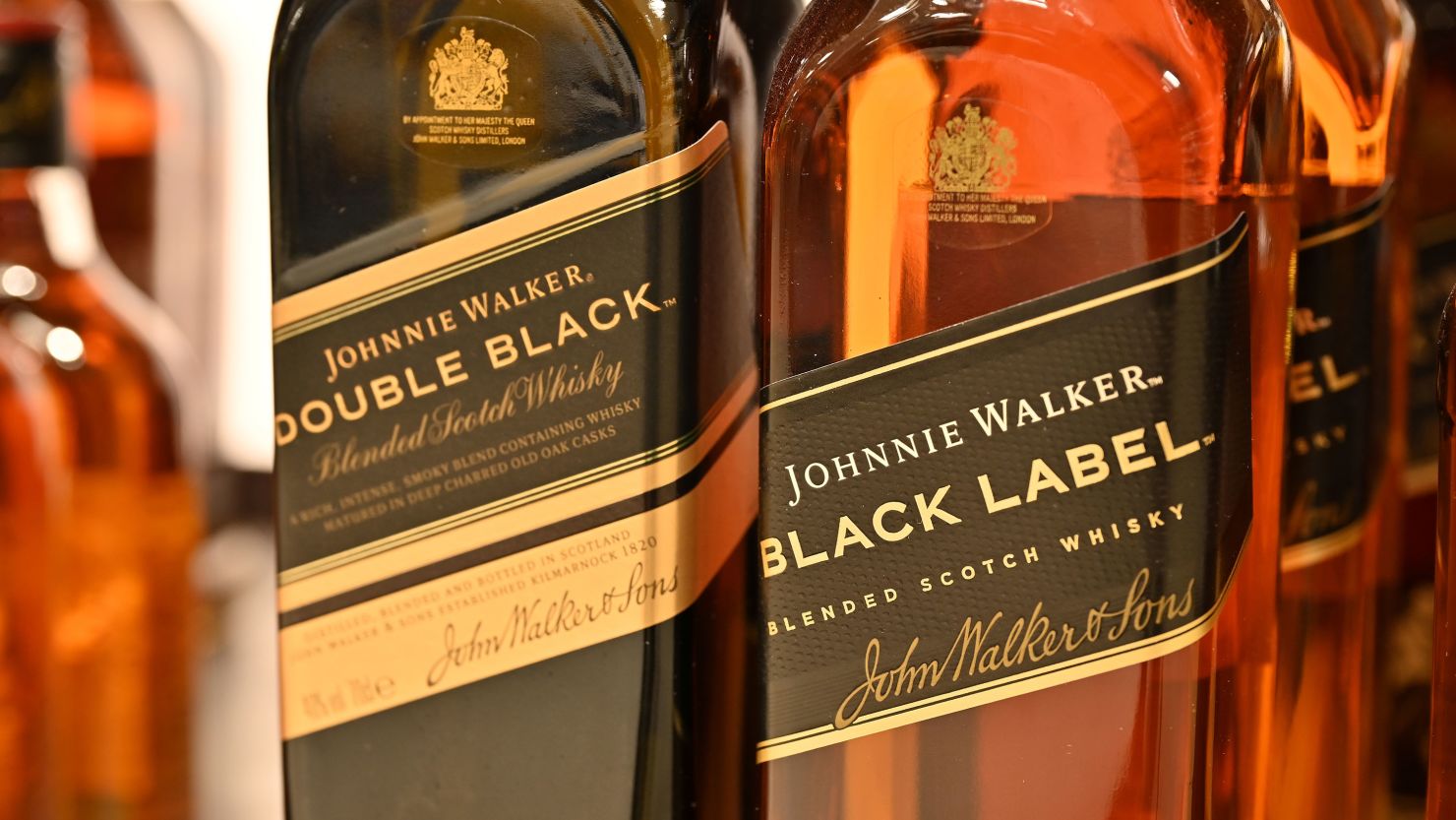 Bottles of Johnnie Walker Black Label and Double Black blended scotch whisky are displayed for sale in January 2024 in Leigh on Sea, England.