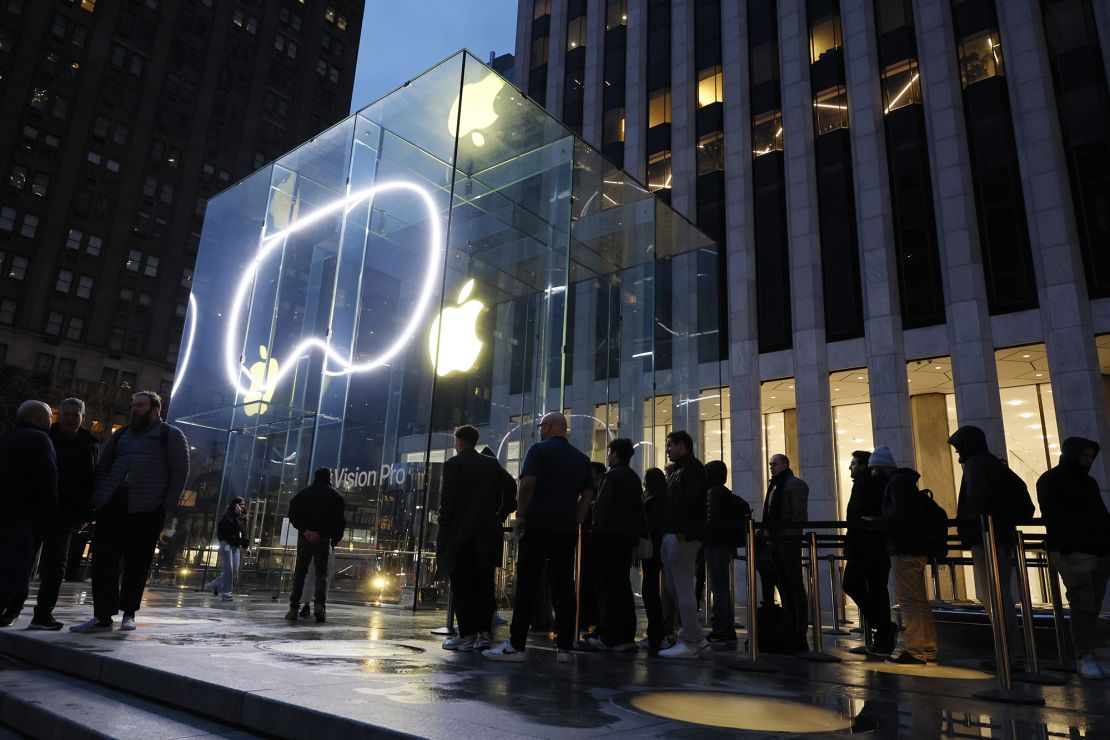 People stand in line to purchase the Apple Vision Pro headset at the Fifth Avenue Apple store on February 02, 2024 in New York City.