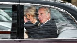 King Charles III and Queen Camilla wave as they leave by car from Clarence House in London on February 6.
