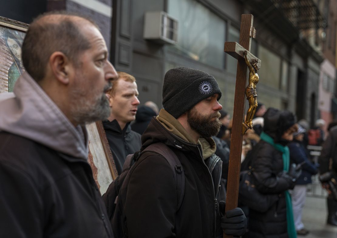 A monk from the Franciscan Friars of the Renewal, left, recites a prayer with anti-abortion activists near a Planned Parenthood clinic on February 3, 2024 in New York City.