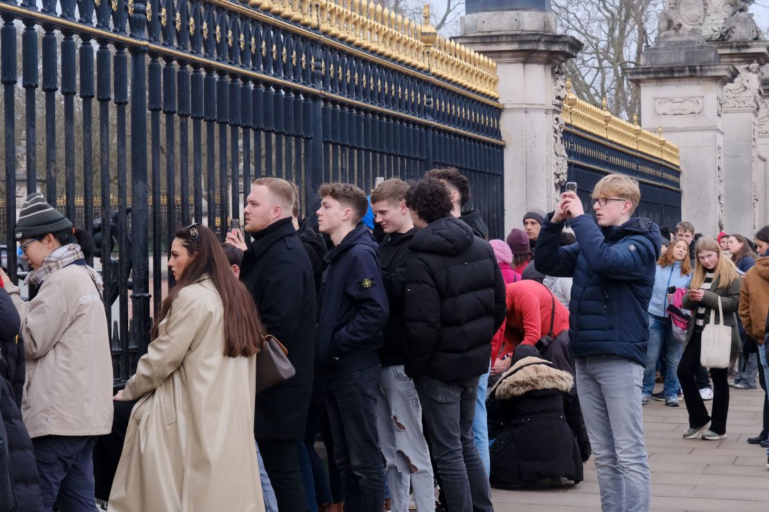 People are seen outside Buckingham Palace on February 6.