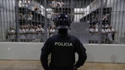 SAN VICENTE, EL SALVADOR - FEBRUARY 6: An officer in riot gear stands on patrol inside a cell at CECOT in Tecoluca on February 6, 2024 in San Vicente, El Salvador. On February of 2023 El Salvador inaugurated Latin America's largest prison as part of President Nayib Bukele's plan to fight gangs. Since then, the UN and NGOs have raised concern about the treatment of inmates, minors being held and suspects incarcerated as gang  without sufficient proof. Meanwhile, Bukele claims El Salvador's murder rate has fallen from the world's highest to the lowest in the Western Hemisphere. (Photo by Alex Peña/Getty Images)