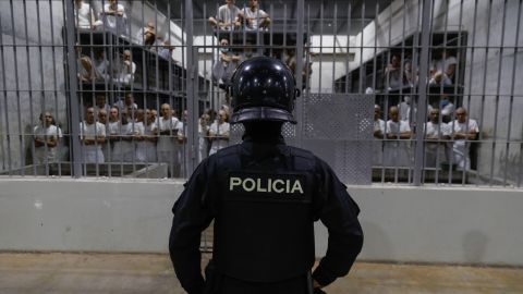 SAN VICENTE, EL SALVADOR - FEBRUARY 6: An officer in riot gear stands on patrol inside a cell at CECOT in Tecoluca on February 6, 2024 in San Vicente, El Salvador. On February of 2023 El Salvador inaugurated Latin America's largest prison as part of President Nayib Bukele's plan to fight gangs. Since then, the UN and NGOs have raised concern about the treatment of inmates, minors being held and suspects incarcerated as gang without sufficient proof. Meanwhile, Bukele claims El Salvador's murder rate has fallen from the world's highest to the lowest in the Western Hemisphere. (Photo by Alex Peña/Getty Images)