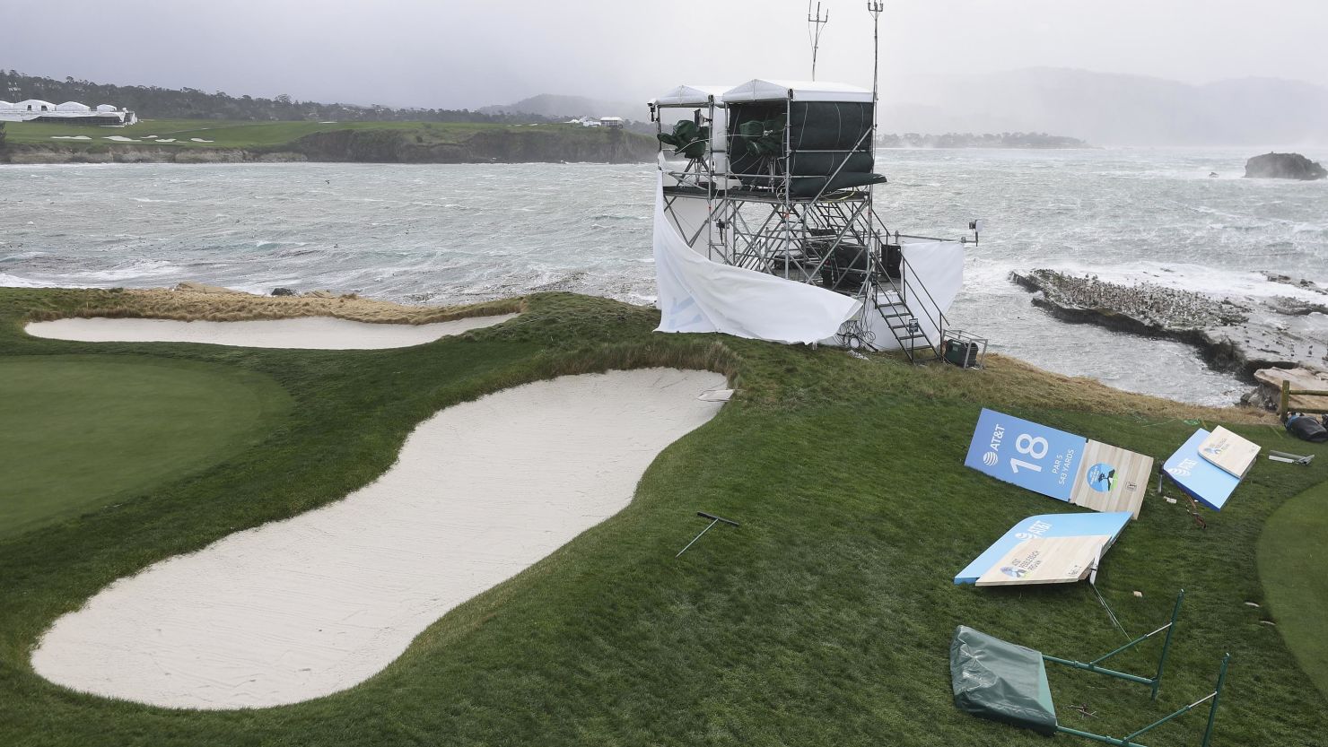 High winds blow against television towers and course signage ahead of the delayed final round start the AT&T Pebble Beach Pro-Am at Pebble Beach Golf Links in California. Sunday's final round was cancelled due to inclement weather.