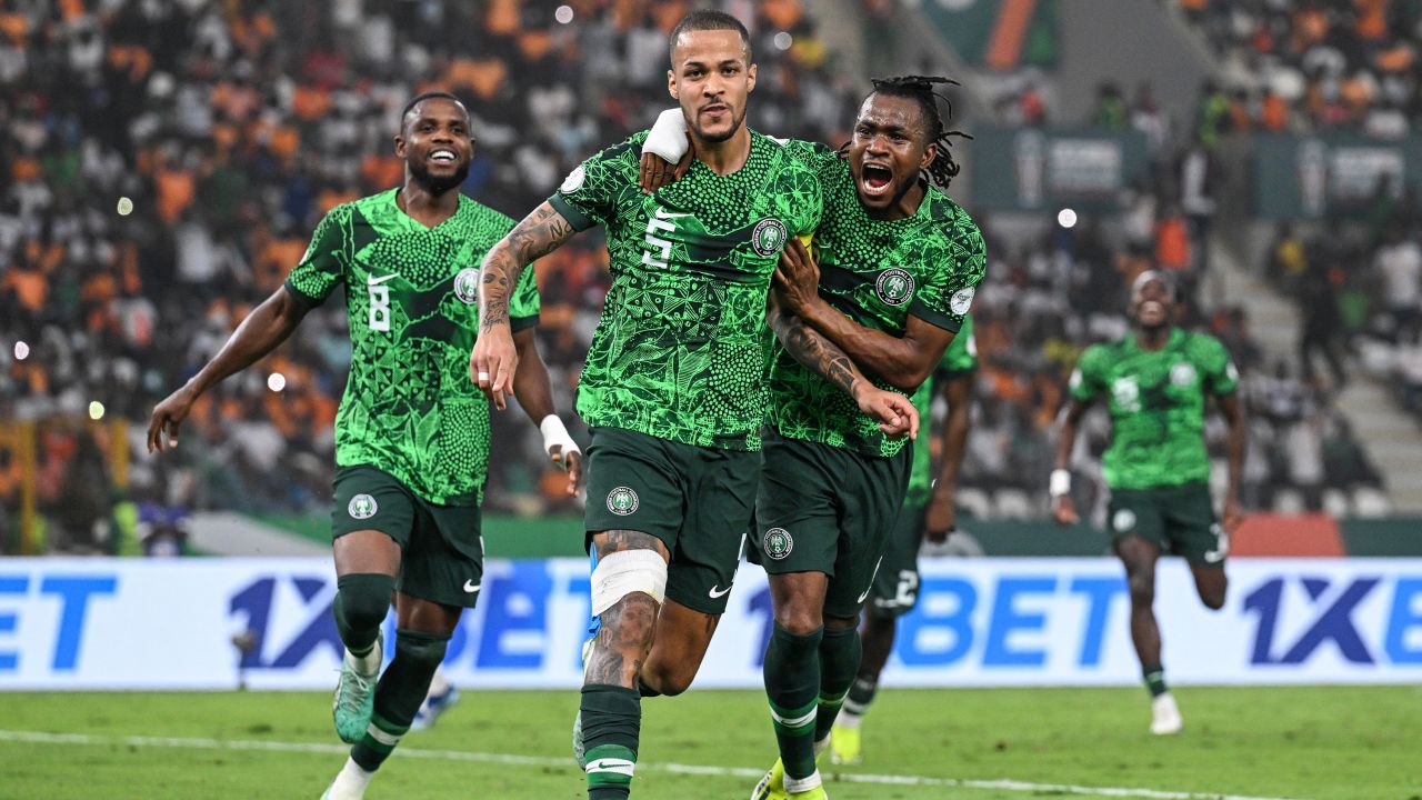 Nigeria's defender #5 William Troost-Ekong (C) celebrates with teammates after scoring his team's first goal from the penalty spot during the Africa Cup of Nations (CAN) 2024 semi-final football match between Nigeria and South Africa at the Stade de la Paix in Bouake on February 7, 2024.