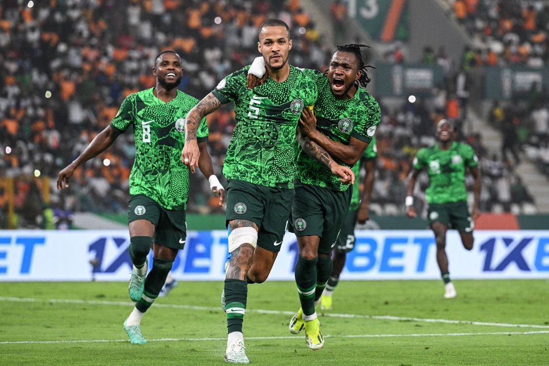 Captain William Troost-Ekong (center, number 5) celebrates after scoring a penalty during Nigeria's AFCON semi-final match against South Africa on February 7, 2024.