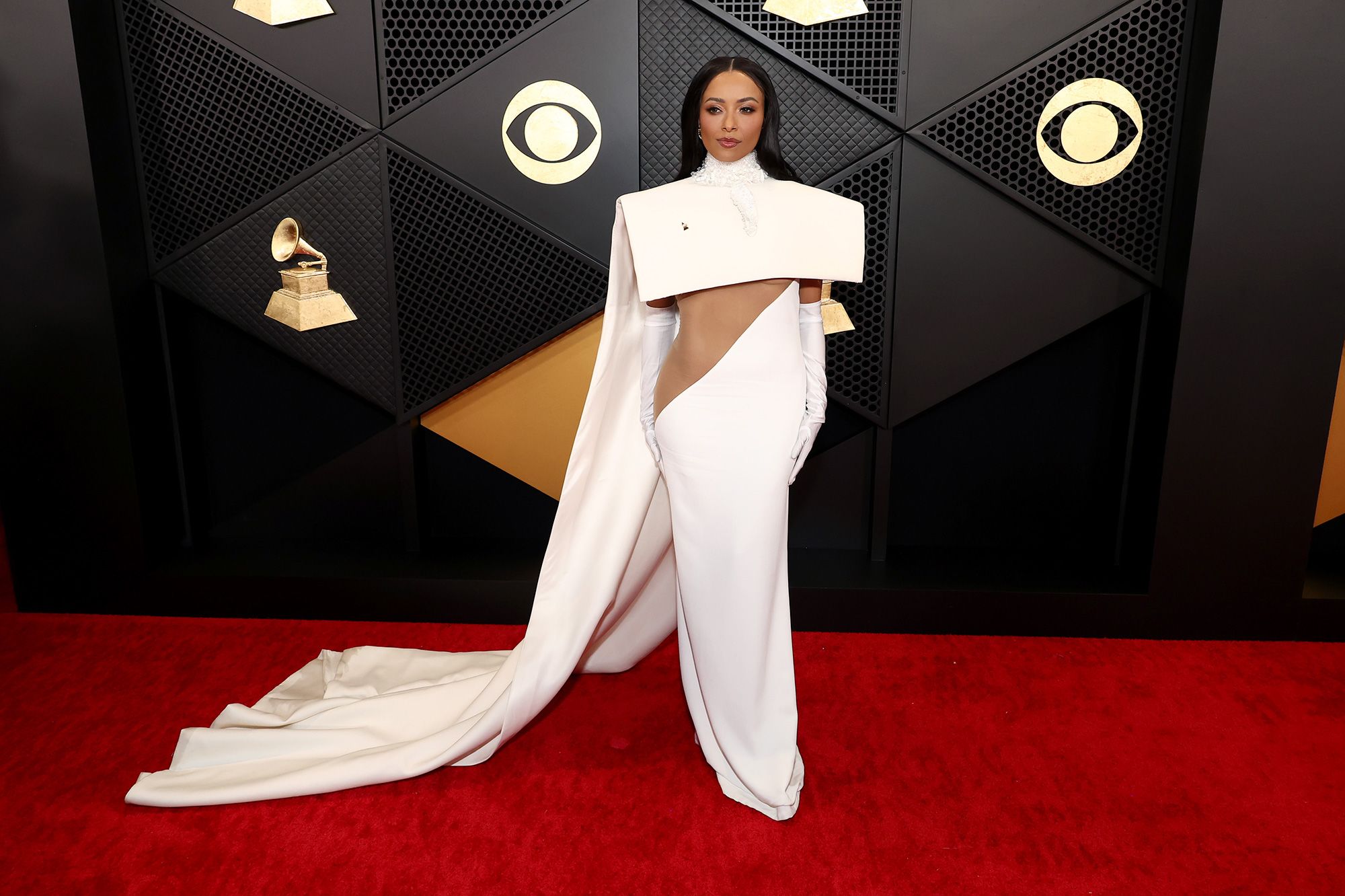 Actor and singer Kat Graham arrived in a cream-colored dress with a structured cape from Stéphane Rolland’s Fall-Winter 2023 Couture collection.