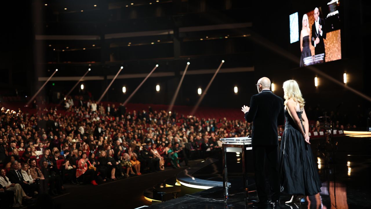 LOS ANGELES, CALIFORNIA - FEBRUARY 04: CEO of The Recording Academy Harvey Mason jr. and Linda Duncombe speak onstage during the 66th GRAMMY Awards at Crypto.com Arena on February 04, 2024 in Los Angeles, California. (Photo by Monica Schipper/Getty Images for The Recording Academy)