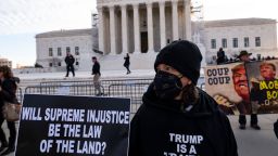 Anti-Trump demonstrators protest outside the US Supreme Court as the court considers whether former US President Donald Trump is eligible to run for president in the 2024 election in Washington, DC, on February 8, 2024. The nation's highest court is hearing arguments in the most consequential election law case since it halted the Florida vote recount in 2000 with Republican George W. Bush narrowly leading Democrat Al Gore. (Photo by ROBERTO SCHMIDT / AFP) (Photo by ROBERTO SCHMIDT/AFP via Getty Images)