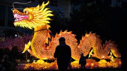 A large illuminated dragon is displayed in a shopping area in Hong Kong on February 8.