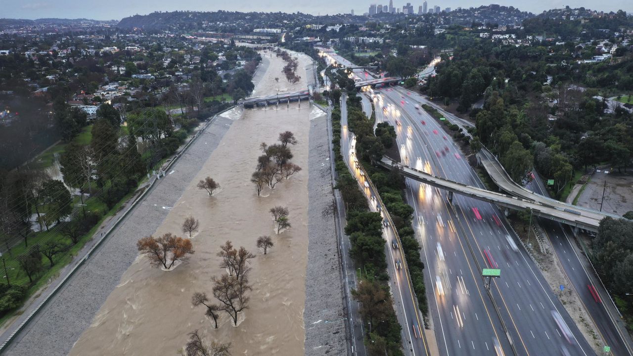 LOS ANGELES, CALIFORNIA - FEBRUARY 05: An aerial view of the Los Angeles River swollen by storm runoff as a powerful long-duration atmospheric river storm, the second in less than a week, continues to impact Southern California on February 5, 2024 in Los Angeles, California. Nearly seven inches of rain have fallen in downtown Los Angeles during the storm, about half the average yearly total. The storm is delivering widespread flooding, landslides and power outages while dropping heavy rain and snow across the region. (Photo by Mario Tama/Getty Images)