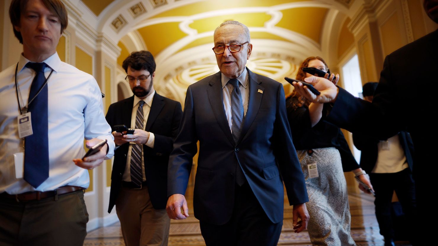 Senate Majority Leader Charles Schumer talks to reporters as he walks to his office at the US Capitol on February 7, in Washington, DC.