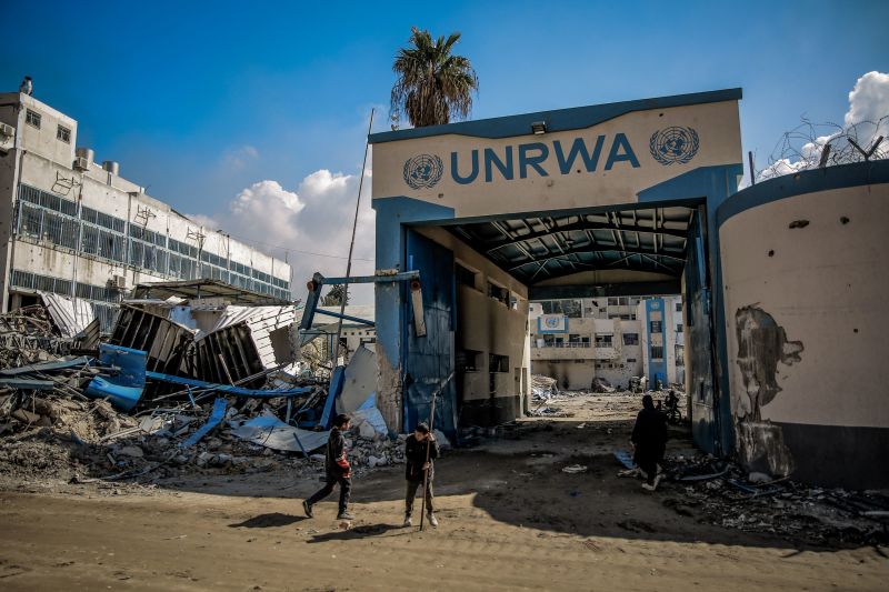 10 February 2024, Palestinian Territories, Gaza City: Palestinians examine the damage to the United Nations Relief and Works Agency for Palestine Refugees (UNRWA) buildings on their way back to their homes in the wake of the Israeli army withdrew from North of Gaza City. Photo: Omar Ishaq/dpa (Photo by Omar Ishaq/picture alliance via Getty Images)