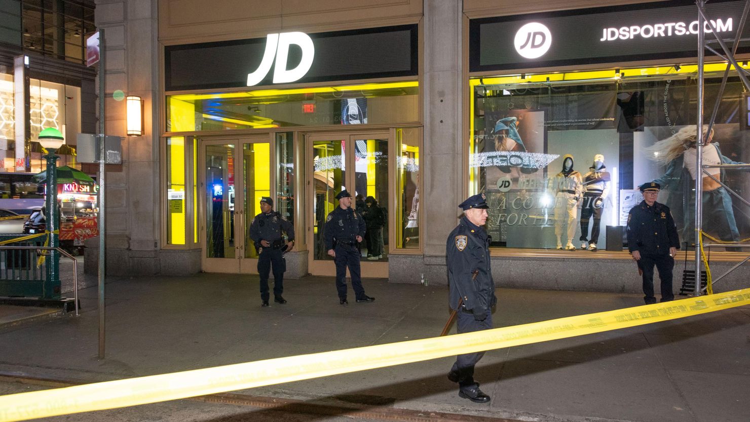 Police respond after a woman was shot inside the JD Sports store in Times Square on February 8, 2024.