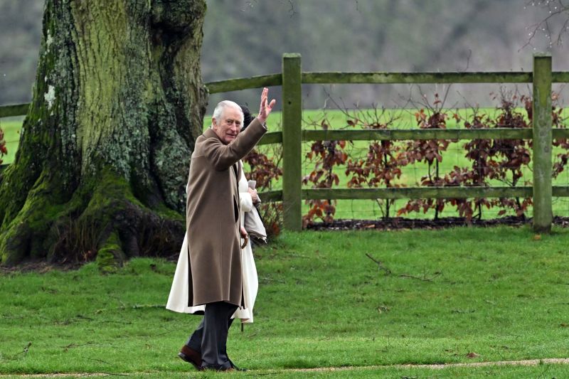 Britain's King Charles III and Britain's Queen Camilla (hidden) arrive at St Mary Magdalene Church on the Sandringham Estate in eastern England on February 11, 2024. Britain's King Charles III on Saturday expressed his 